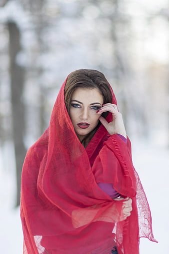 Woman in Red Scarf in Snowy Forest