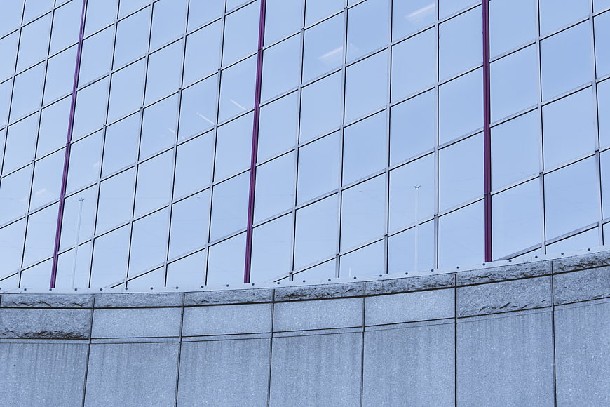 Modern Glass Building Facade with Purple Accents