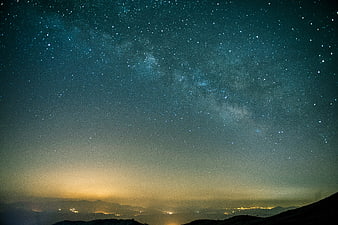 Milky Way Galaxy Over Mountainous Landscape At Night