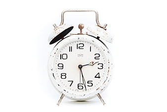 Vintage White Alarm Clock with Rust Details on White Background