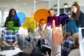 Business team meeting with colorful communication speech bubble icons