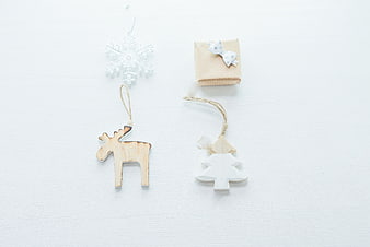 Minimalist Christmas Ornaments and Gift on White Background