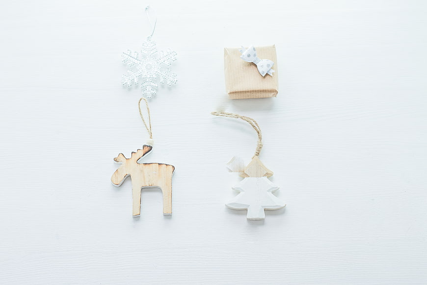 Minimalist Christmas Ornaments and Gift on White Background