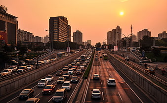 Busy Urban Highway Traffic at Golden Hour Sunset in Beijing