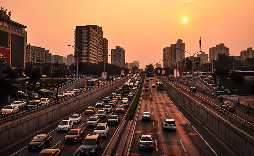 Busy Urban Highway Traffic at Golden Hour Sunset in Beijing