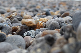 Close-up of smooth pebbles on a rocky beach