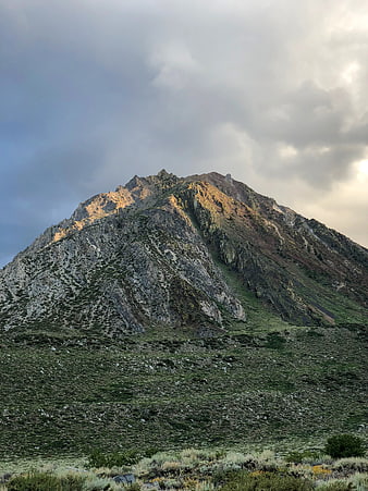 Majestic Rocky Mountain Peak with Golden Hour Sunlight