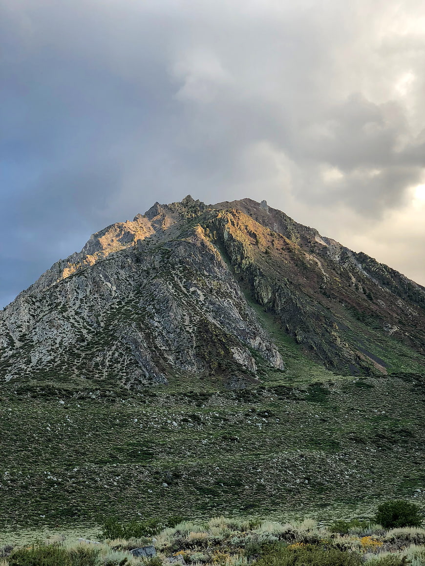 Majestic Rocky Mountain Peak with Golden Hour Sunlight