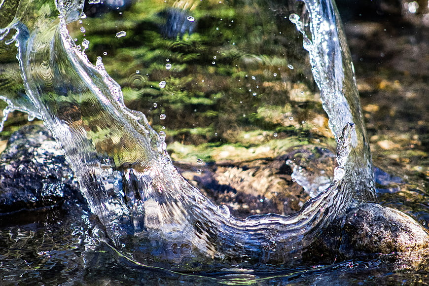 Dynamic Water Splash on Rocks in a River