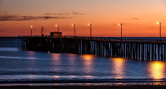 Silhouette of Pismo Beach Pier at Sunset with Orange Sky