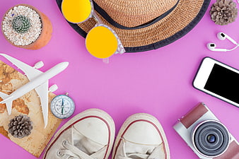 Summer Travel Essentials Flat Lay on Pink Background
