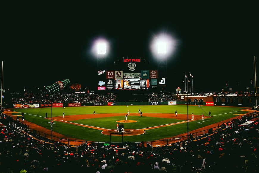 Night baseball game at AT&T Park with stadium lights and crowd