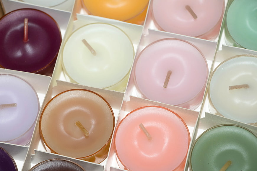 Top View of Assorted Pastel Candles in White Boxes