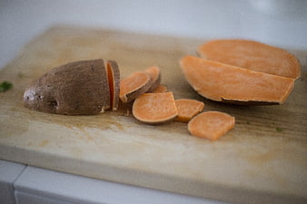 Sliced Sweet Potatoes on Wooden Cutting Board
