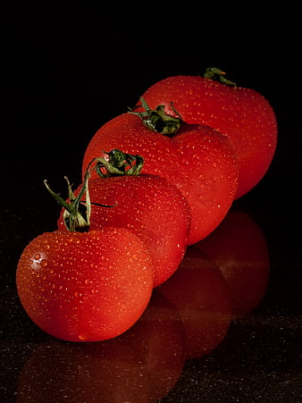Fresh Red Tomatoes With Water Droplets On Black Background