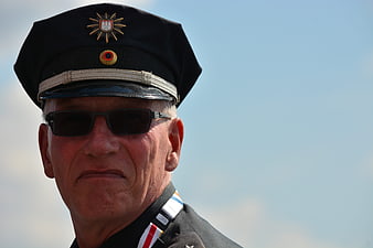 Senior Security Guard In Uniform And Sunglasses