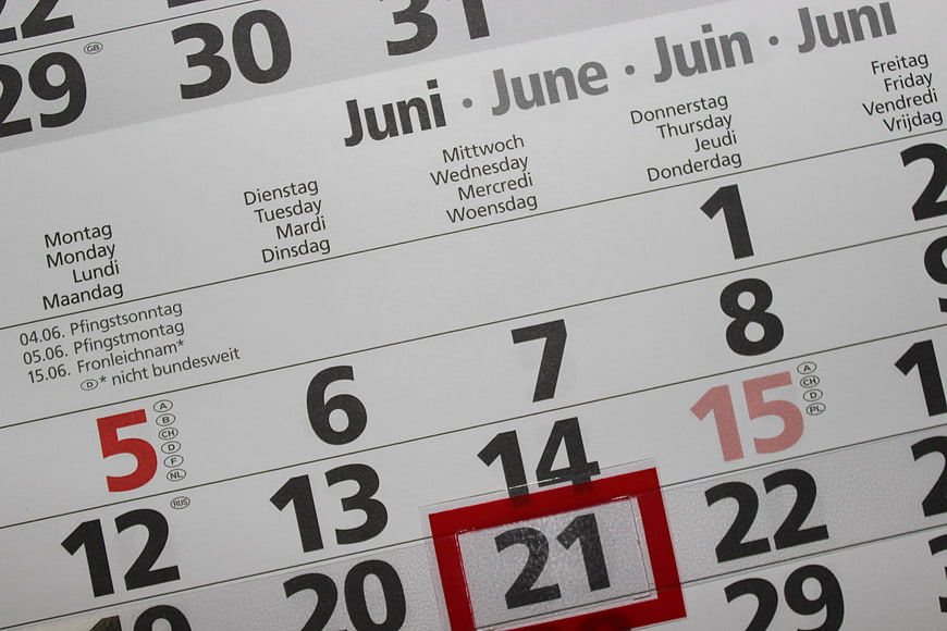 Close-up of June Calendar with Date 21 Highlighted in Red
