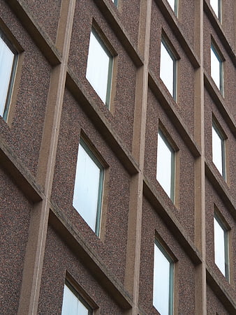 Abstract Brutalist Concrete Building Facade with Windows