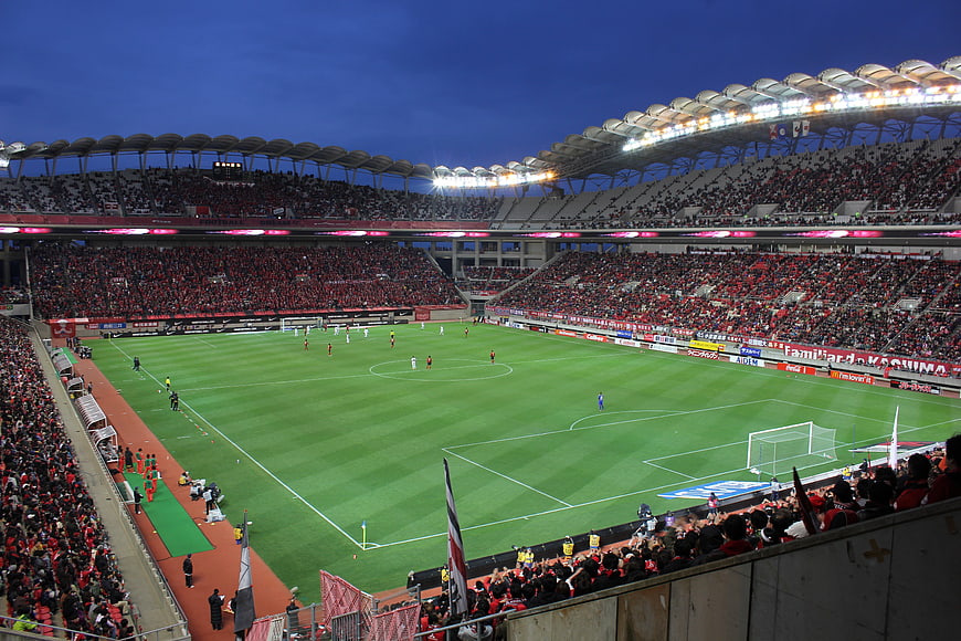 Wide Angle View of Soccer Stadium at Night with Crowd