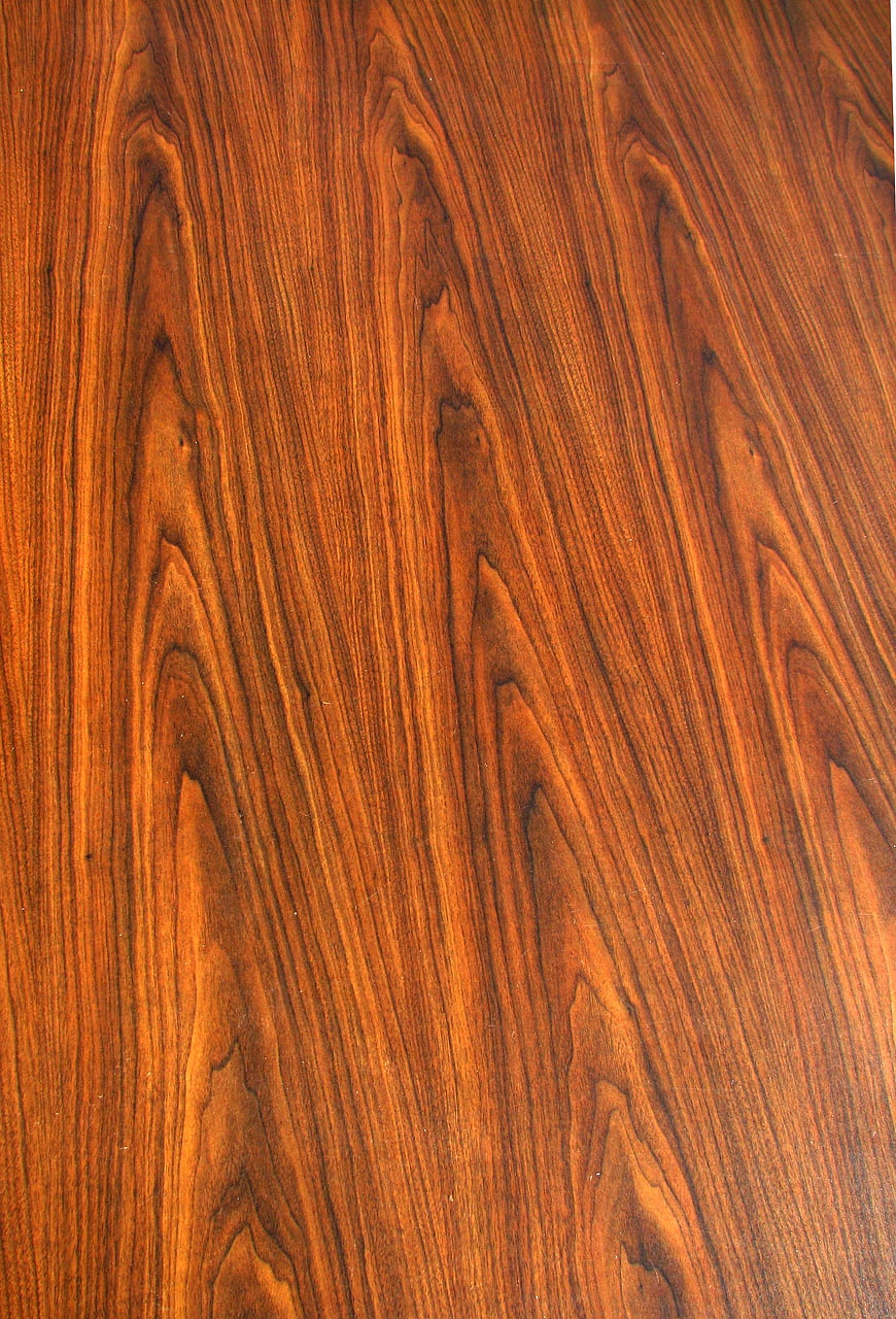 Close-up of rich brown wood grain texture pattern