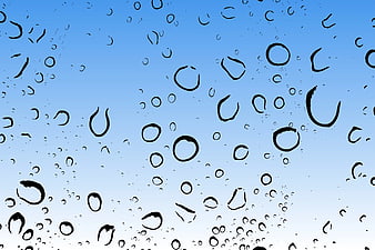 Raindrops on Glass Window with Blue Sky Background