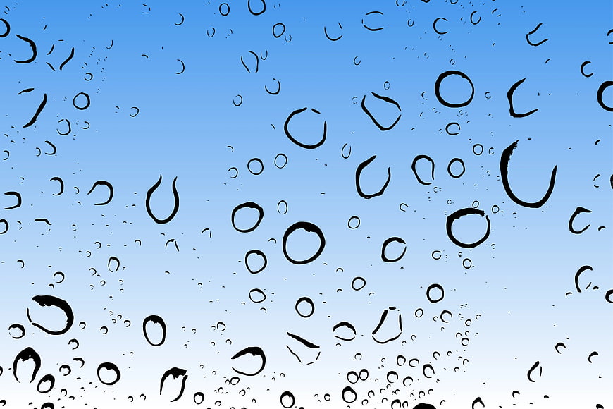 Raindrops on Glass Window with Blue Sky Background