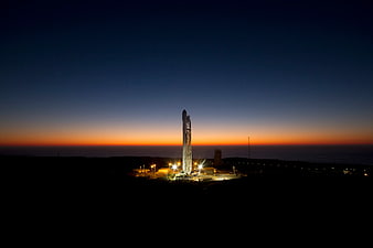 SpaceX Starship rocket on launch pad at twilight