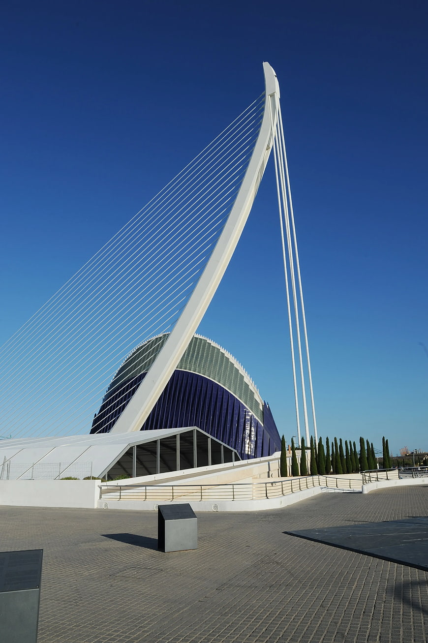Modern White Cable-Stayed Bridge and Blue Glass Building