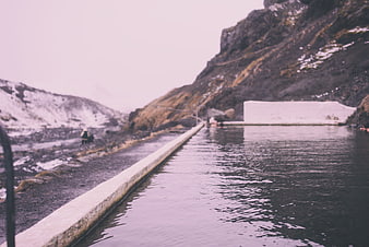 Geothermal outdoor pool in Icelandic mountain landscape