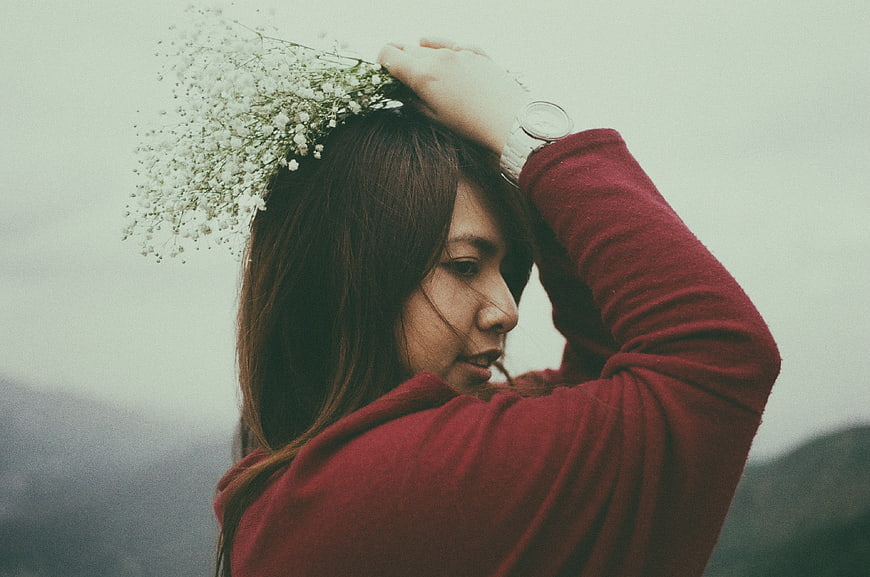 Asian woman with baby's breath flowers in hair