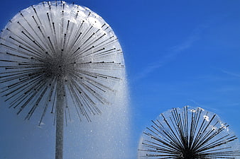 Frozen Fountain Jets Against Blue Sky