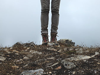 Hiker Boots on Rocky Mountain Peak in Fog