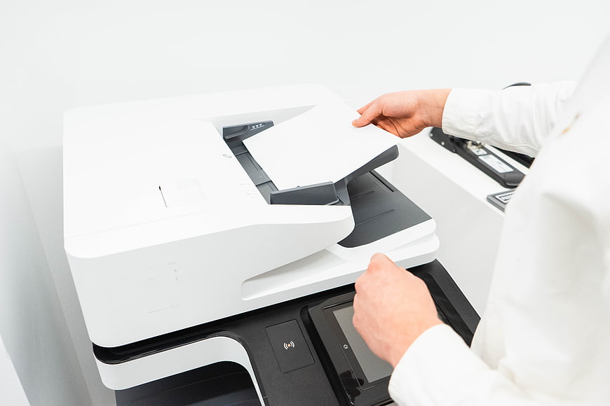 Person Using Office Printer and Copier Machine