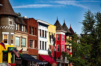 Colorful Row Houses with Mural and Flags