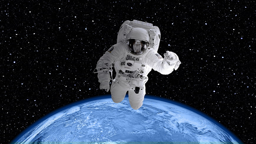 Astronaut Floating in Space Above Earth