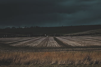 Dramatic Stormy Sky Over Plowed Agricultural Field