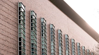 Modern brick building facade with vertical windows