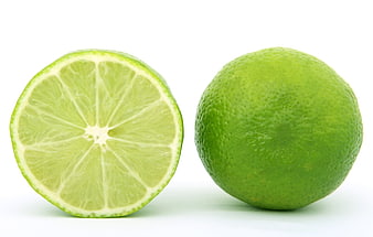 Fresh Green Lime Whole and Sliced on White Background