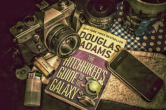 Vintage Praktica Camera, Film, and Hitchhiker's Guide to the Galaxy Book