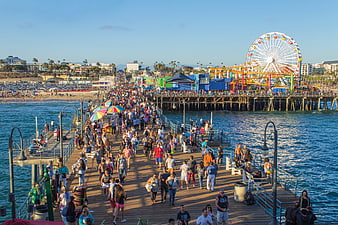 Crowded Santa Monica Pier with Ferris Wheel and Ocean View