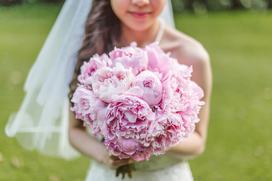 Bride Holding Pink Peony Bouquet Outdoors