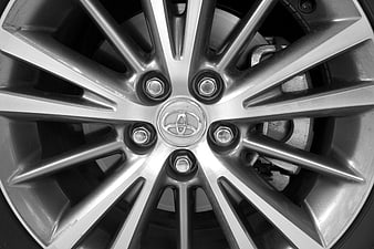 Close-up of silver Toyota car wheel rim with logo