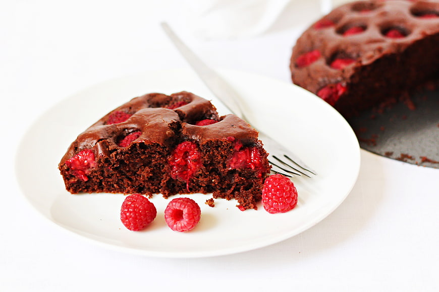 Slice of Chocolate Raspberry Cake on White Plate