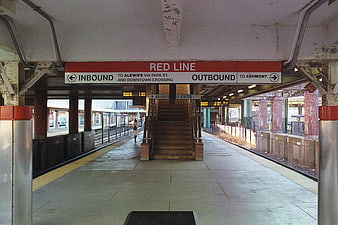 Red Line Subway Station Platform with Directional Signs