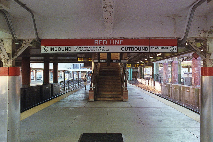 Red Line Subway Station Platform with Directional Signs
