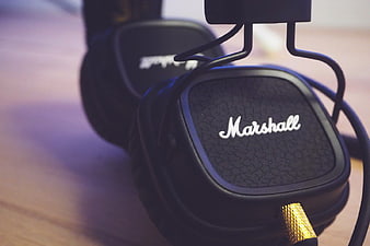 Close-up of Black Marshall Headphones on Wooden Stand