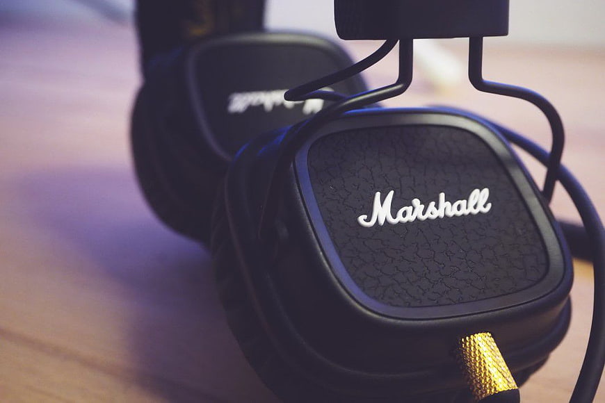 Close-up of Black Marshall Headphones on Wooden Stand