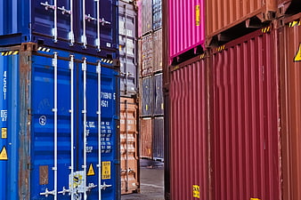 Colorful Stacked Shipping Containers In Industrial Port Yard