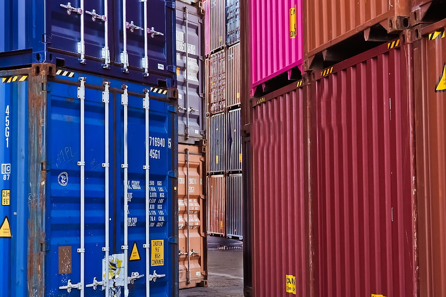 Colorful Stacked Shipping Containers In Industrial Port Yard