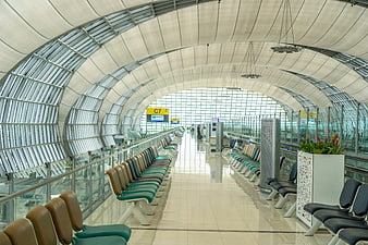 Modern Airport Terminal Waiting Area with Arched Ceiling